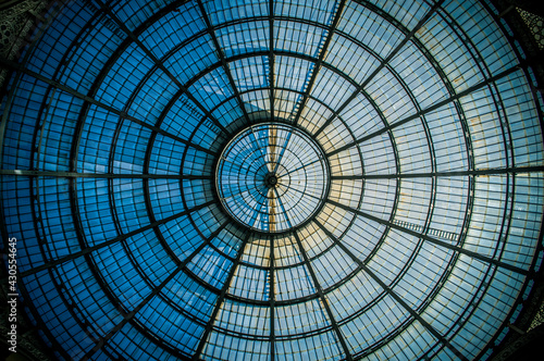 Abstract circular pattern of the glass dome of the Galleria Vittorio Emanuele II in Milan, Lombardy, Italy.