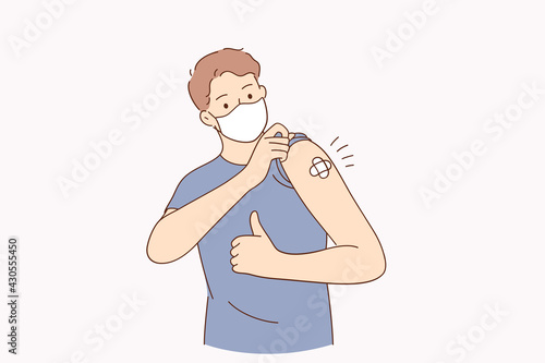 Vaccination against covid-19 concept. Young Man wearing face mask standing and showing his vaccinated arm received corona vaccine looking at camera vector illustration 