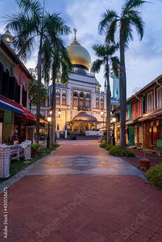 Illuminated Arab street and Masjid Sultan Mosque with no people during city lock down at Kampong Glam, Singapore.