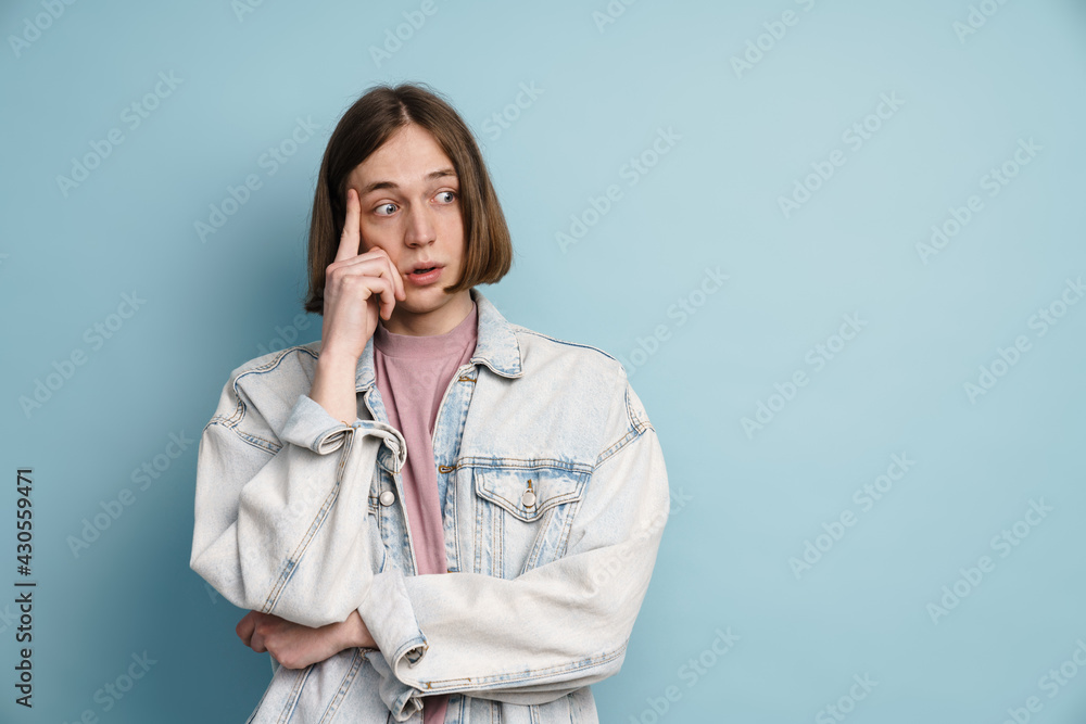 Young european man expressing surprise and looking aside Young european man expressing surprise and looking aside
