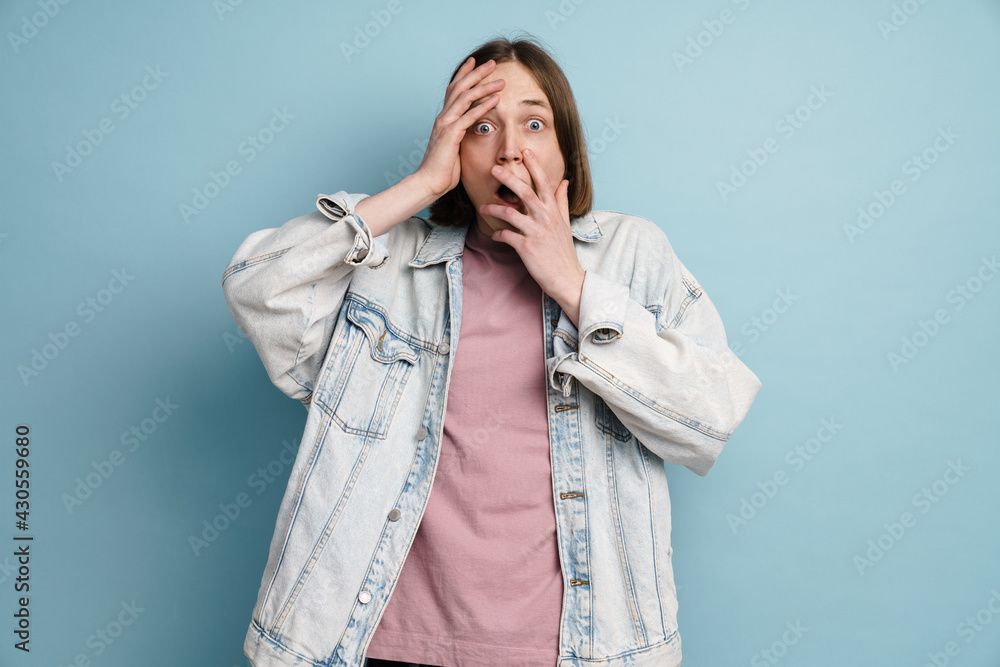 Young european scared man expressing surprise at camera Young european scared man expressing surprise at camera