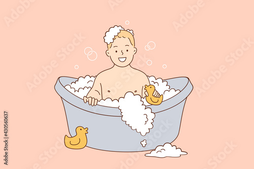 Hygiene and care for children concept. Happy laughing boy kid taking bath playing with foam bubbles.sitting in bathroom vector illustration 