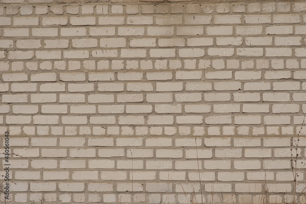 Fototapeta premium White old brick textured wall, yellowed with time. Brick background. 