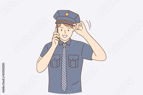 Policeman during work concept. Young handsome positive policeman wearing police uniform talking on smartphone outdoors vector illustration 