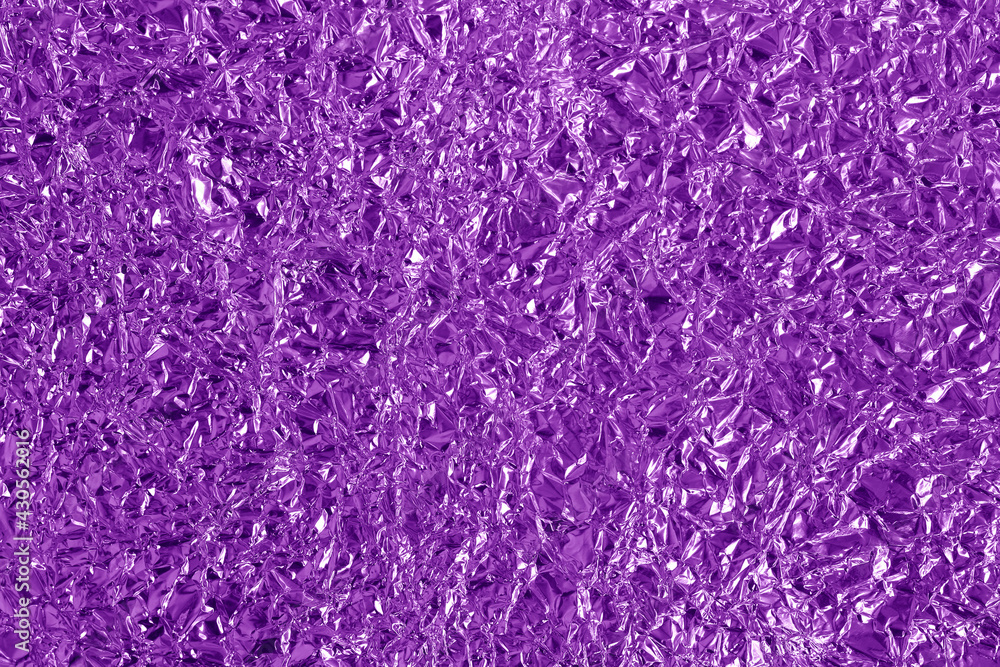 Obraz premium Purple metallic foil shiny texture, wrinkled wrapping paper for background and design art work.
