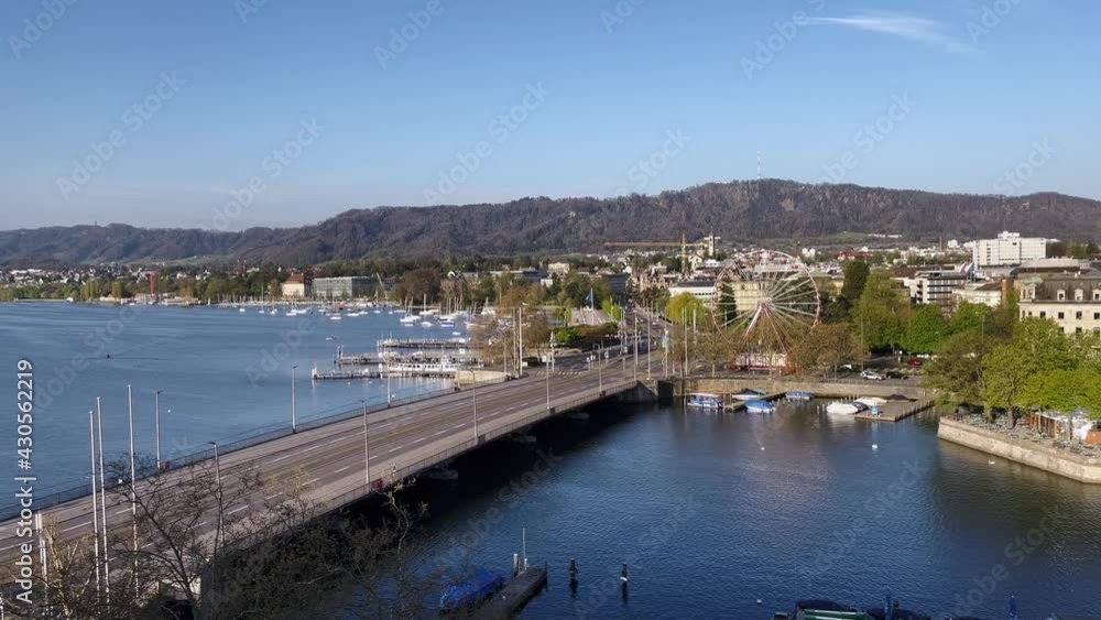Aerial View of Zurich City and Lake with blue tram over the bridge. Aerial View of Zurich City and Lake with blue tram over the bridge.