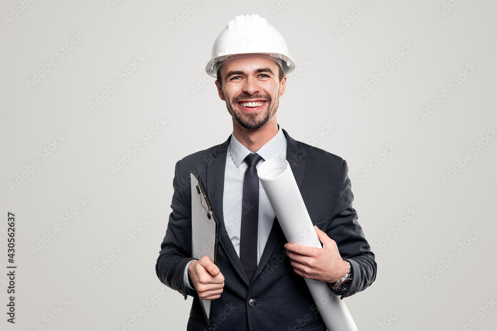 Cheerful architect in hardhat with blueprints Cheerful architect in hardhat with blueprints