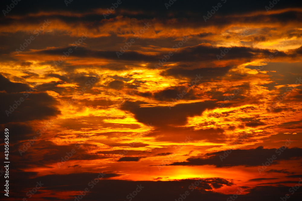 Beautiful sunset sky, yellow clouds (background)