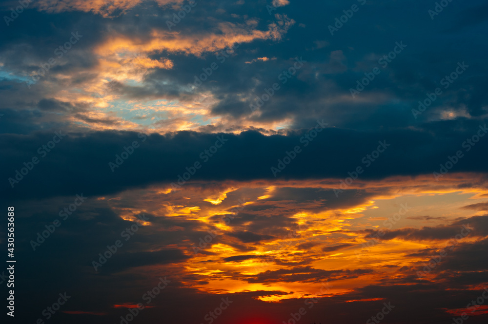 Beautiful summer sunset sky, yellow clouds Beautiful summer sunset sky, yellow clouds