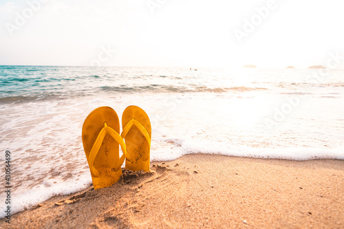 Yellow Flip flops on the beach