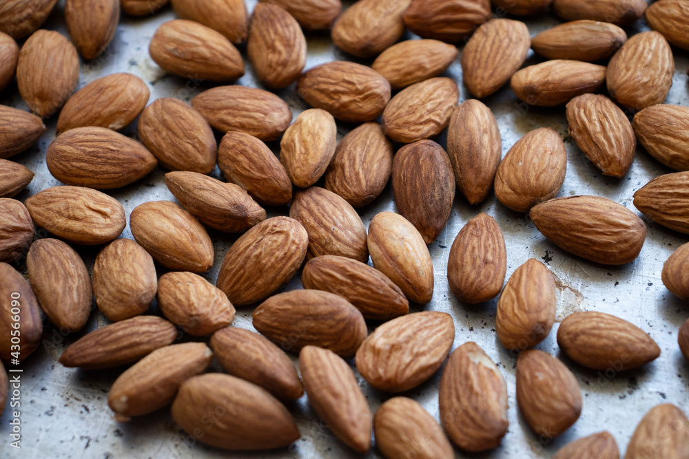 roasted almonds are on a baking sheet. Homemade almonds, protein, healthy nuts. Almond kernels roasted almonds are on a baking sheet. Homemade almonds, protein, healthy nuts. Almond kernels