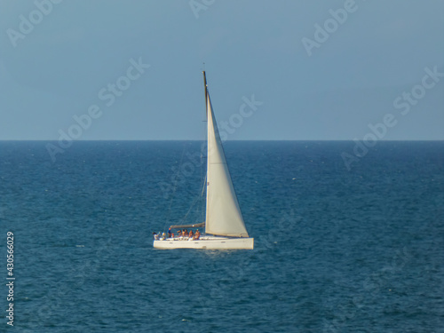 Sailing boat sailing on a calm sea © Jose