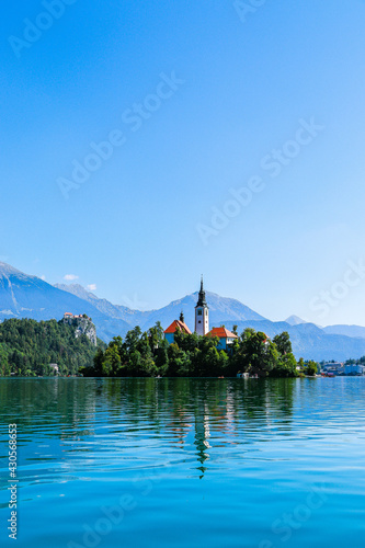 Vertical shot of Lake Bled and Bled Castle in Krajna, Slovenia photo