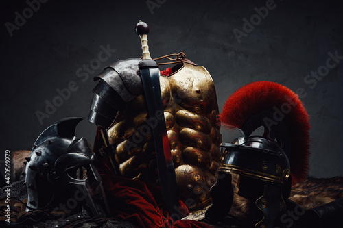 Fototapeta Gladius and bronze armor with two helmets