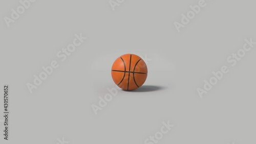 Side on view of a 3D basketball rolling from right to left. Standard orange basket ball in a continuous roll perfect for sports advertising. 4K clip at 30fps for smooth motion with an alpha matte.