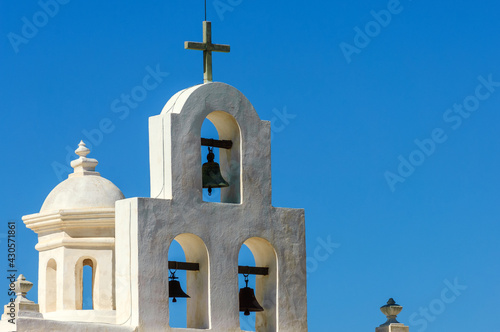 White bell tower of Mission San Xavier del Bac (famous White Dove of the Desert) in Tohono O'odham Indian Reservation, Arizona, USA #430571861