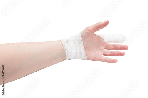 White-skinned hand with bandaged index finger and wrist, palmar side, isolated on white background.
