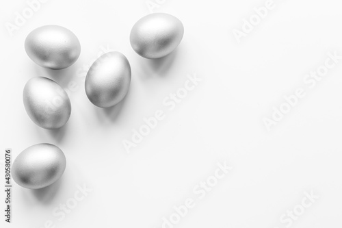 Silver eggs isolated on white background. Easter decoration background. Top view