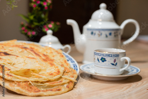 paratha with chai tea set Indian and Pakistani food photo