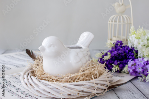 Easter decoration with bird and lilac, inspiration concept