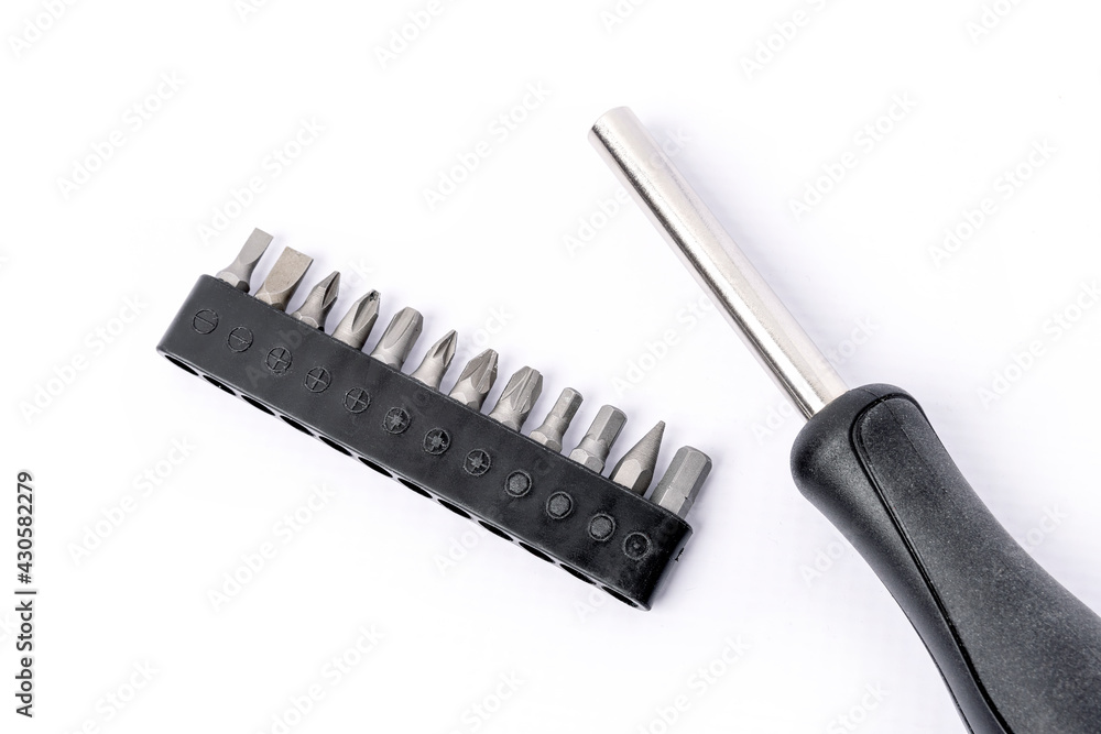 Screwdriver with magnetic bit holder set on white background.
Screwdriver with magnetic bit holder set on white background.