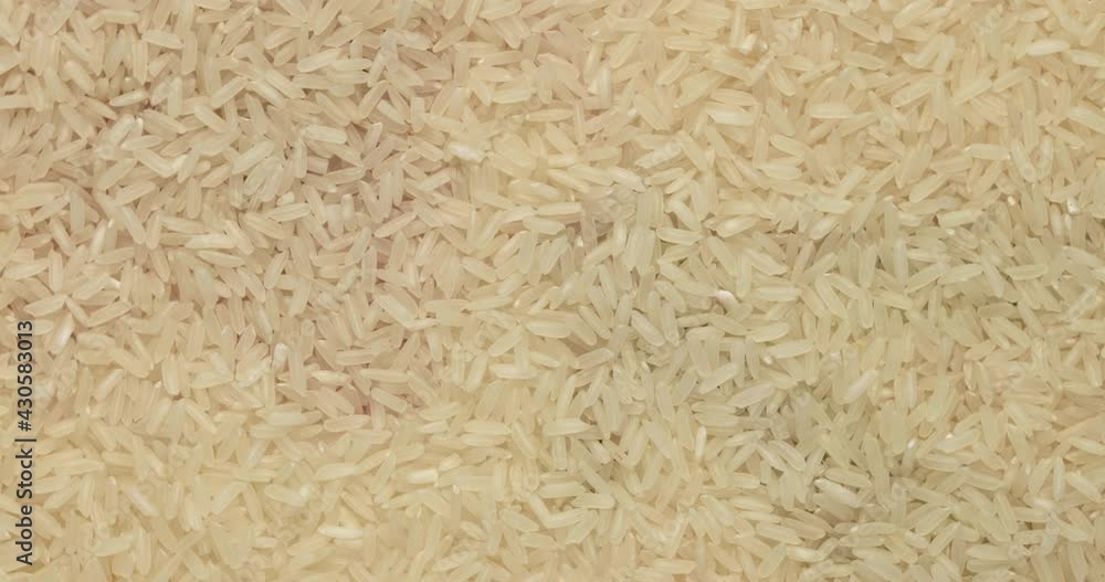 Closeup rice groats rotation, background, texture. Slow motion. Food background. Closeup rice groats rotation, background, texture. Slow motion. Food background.
