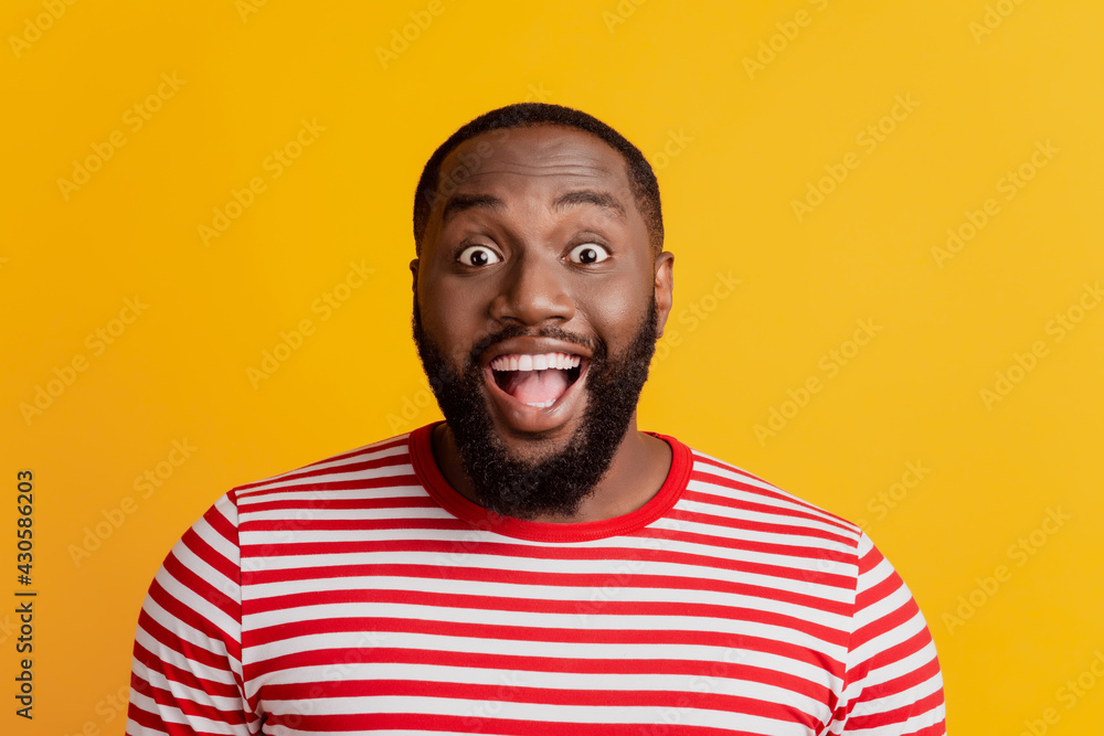 Portrait of excited crazy man look camera open mouth on yellow background Portrait of excited crazy man look camera open mouth on yellow background