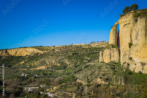 View on the cliffs from the foot of the Ronda bridge in Andalusia, Spain