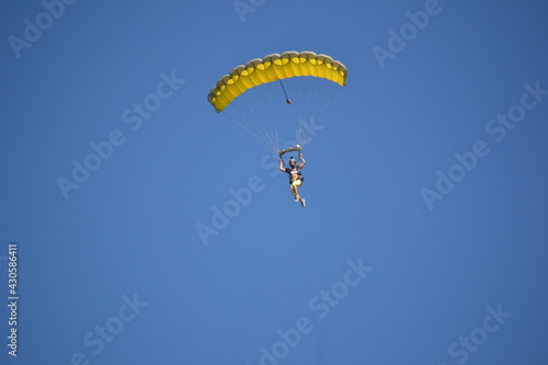 paragliding in the blue sky