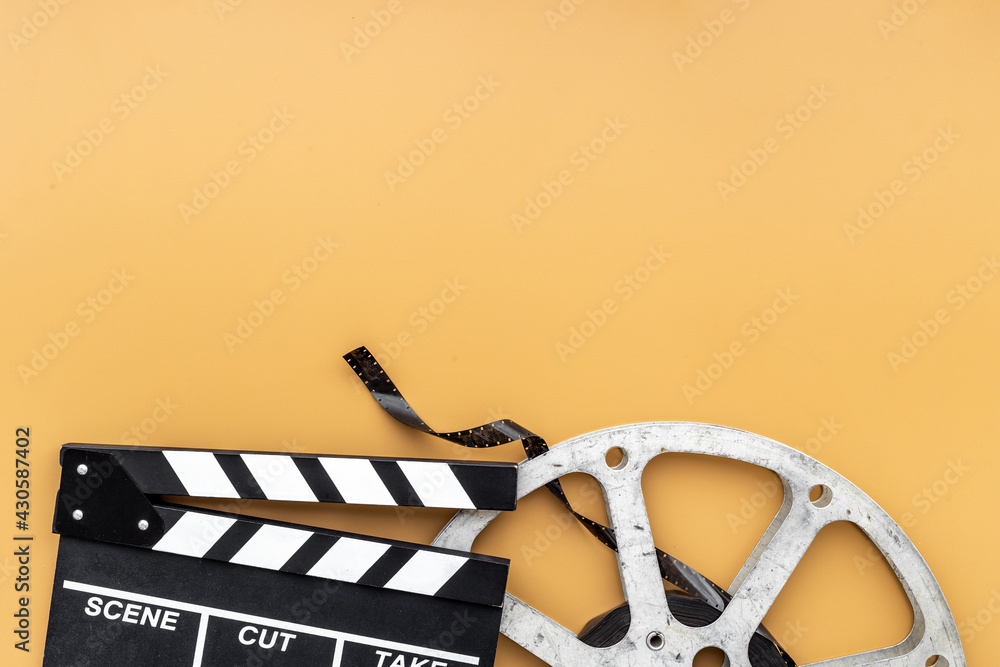 Motion picture film reel with movie clapper. Cinema concept