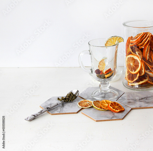 dried fruit in a jar and on the table. vegetarianism and healthy eating. energy for all time from healthy food. beautiful fruits in jars. weight loss. orange white glass. High quality photo