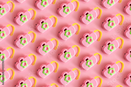 Pattern, Isolated toy camera, green color, on green background. Top view.