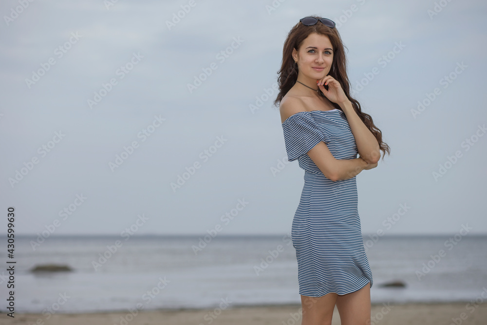 beautiful happy adult woman early morning on the beach beautiful happy adult woman early morning on the beach