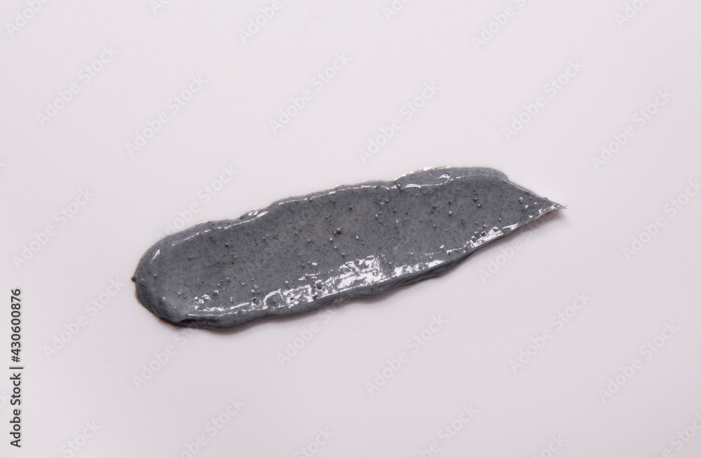 Skin scrub smear on white background. Cosmetic product. Cleansing and exfoliating your skin Skin scrub smear on white background. Cosmetic product. Cleansing and exfoliating your skin