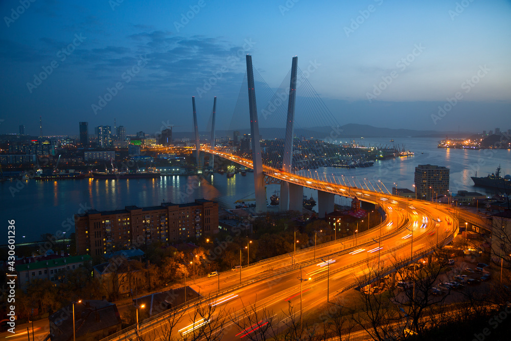 Zolotoy Bridge (Golden Bridge) at night - cable-stayed bridge over the Golden Horn Bay in Vladivostok, Russia