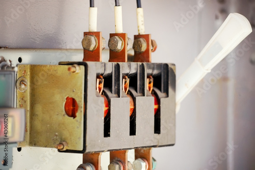 Fényképezés The old manual switch of disconnecting the voltage in the transformer box close-up