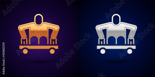 Gold and silver Man without legs sitting wheelchair icon isolated on black background. Disability concept. Guy with physical disabilities. Vector