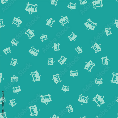 Green Man without legs sitting wheelchair icon isolated seamless pattern on green background. Disability concept. Guy with physical disabilities. Vector