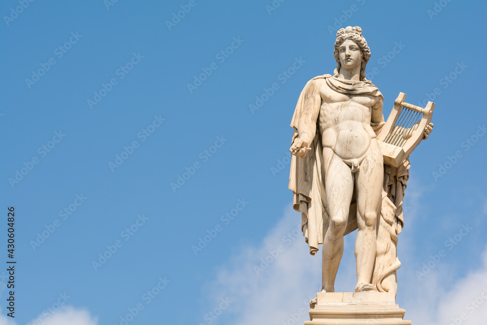 The statue of Apollo. Member of the Twelve Olympians, God of oracles, healing, archery, music and arts, sunlight, knowledge, herds and flocks, and protection of the young. Athens, Greece - obrazy, fototapety, plakaty 