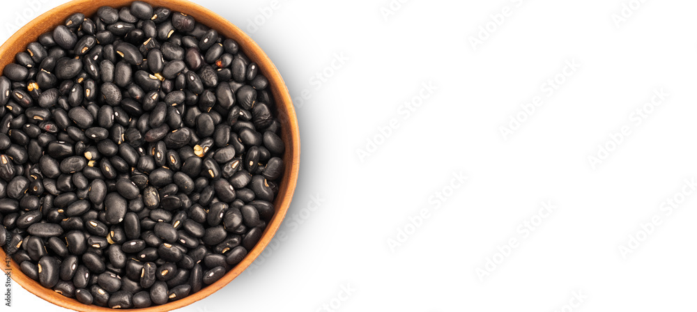 Black beans in wooden bowl on white background, top view, copy space Black beans in wooden bowl on white background, top view, copy space