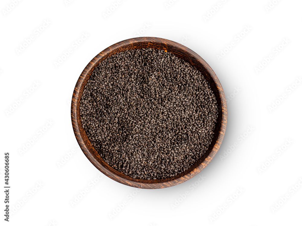 Healthy basil seeds in wooden bowl on white background, top view Healthy basil seeds in wooden bowl on white background, top view