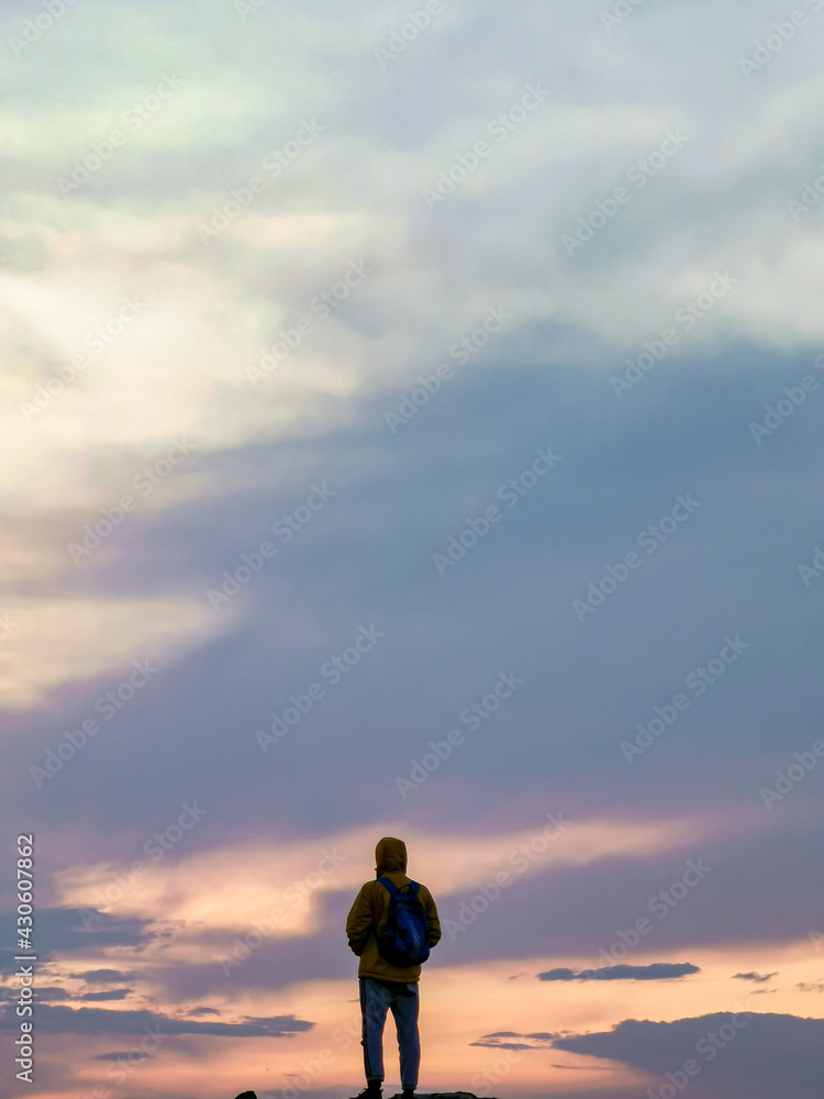 silhouette of a man standing on the beach