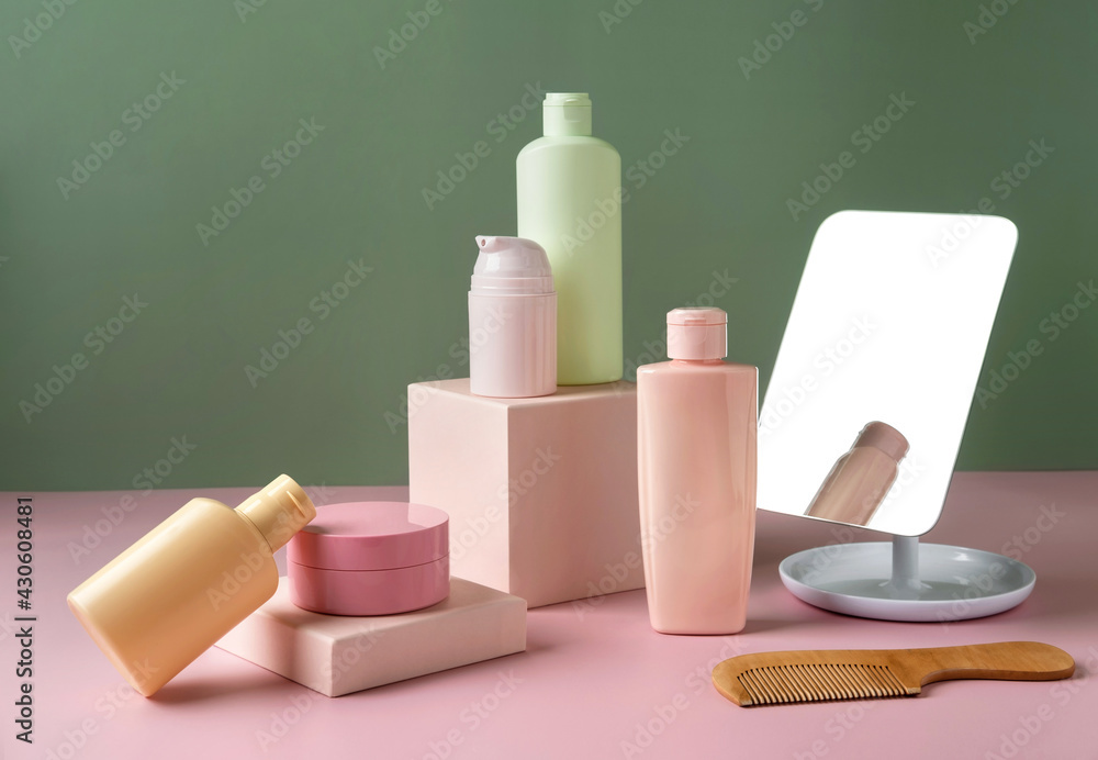 Cosmetics product advertising. Cosmetics products on pink podium and green background. Beauty cosmetics concept. Cosmetics product advertising. Cosmetics products on pink podium and green background. Beauty cosmetics concept.