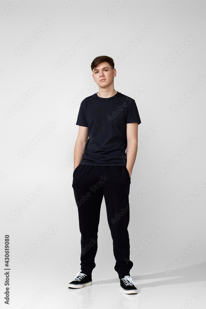 Handsome guy in black t-shirt looking into camera Handsome guy in black t-shirt looking into camera
