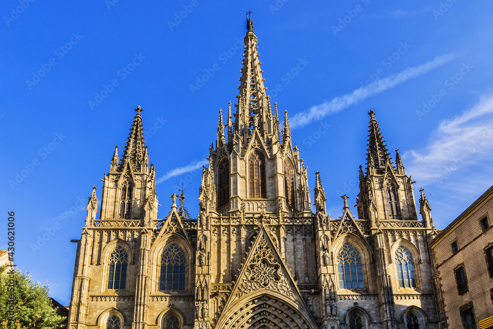 Architectural fragments of Barcelona Cathedral (1298) - Gothic Basilica La Catedral de la Santa Creu i Santa Eulalia at sunset. Gothic Quarter, Barcelona, Spain.