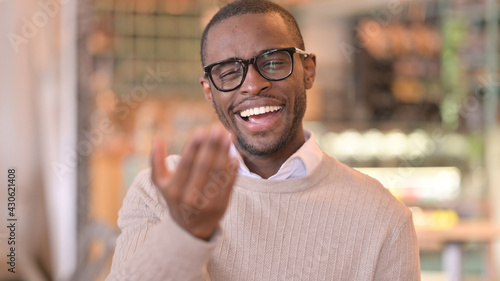 Portrait of Assertive African Man Inviting People