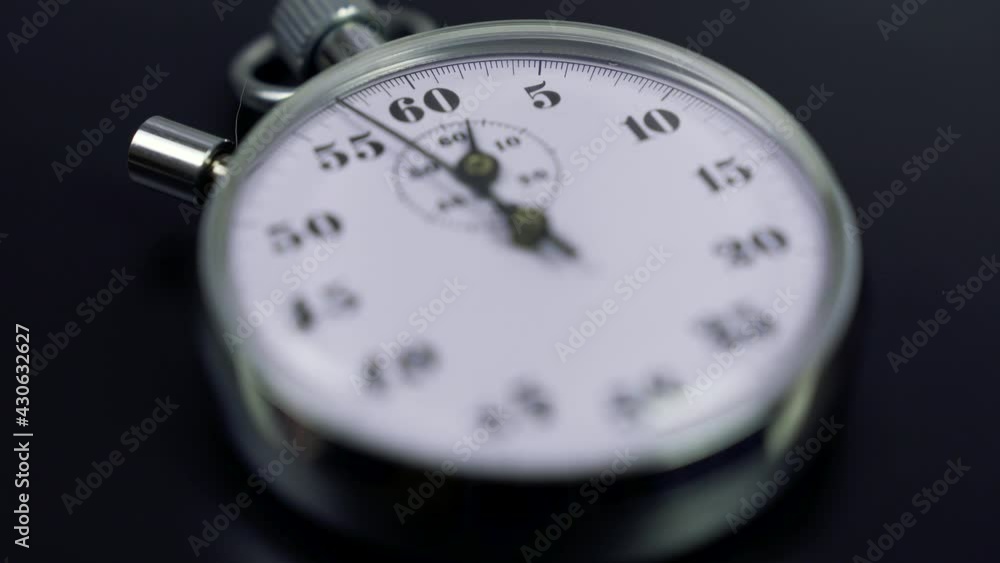 Macro shot of a classic metallic retro mechanical analog stopwatch against a dark background, counting down the seconds. Time management concept.
Macro shot of a classic metallic retro mechanical analog stopwatch against a dark background, counting down the seconds. Time management concept.