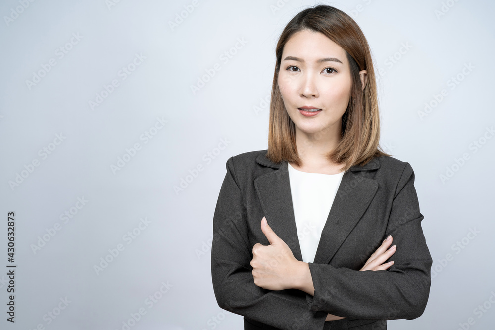 Beautiful Asian businesswoman in a black suit, isolated on a white background. Beautiful Asian businesswoman in a black suit, isolated on a white background.