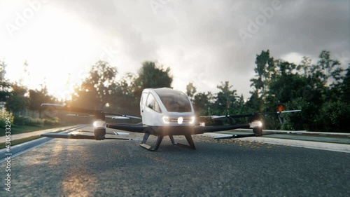 An unmanned passenger air taxi stands on the road waiting for a client. Animation for transport, sci-fi or innovative backgrounds. View of an unmanned aerial passenger vehicle. photo