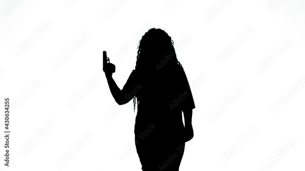Silhouette of a woman with a pistol at a temple on a white background. Medium plan Silhouette of a woman with a pistol at a temple on a white background. Medium plan